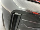 a close up of a car that has a denting on it