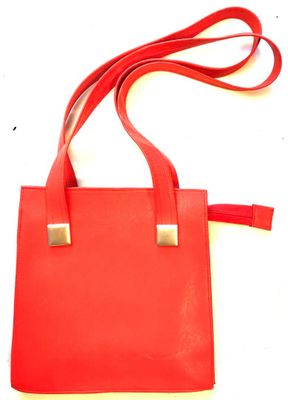 an image of a red purse with a red strap on it