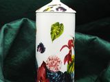 an image of a white container with a rooster design on it
