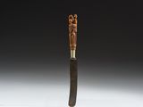 a close up of a wooden stick with a metal handle