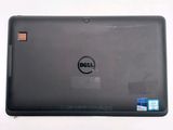 the back of a dell laptop with a sticker on it
