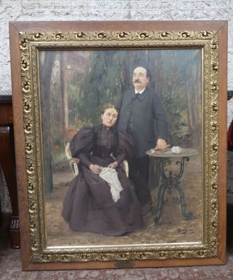 tableau représentant un homme et une femme assis devant une table