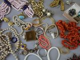 many different types of jewelry on the table