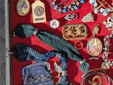 a shadow box that has a lot of jewelry in it