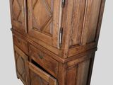 an image of a wooden cabinet with a drawer underneath it