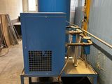 a blue machine that is sitting in the middle of a room