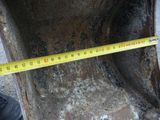 a measuring tape that is on the side of a pipe
