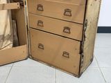 a cardboard box with a file cabinet inside of it