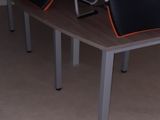 many chairs that are lined up on the table