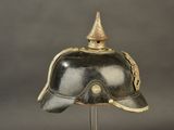 a helmet on a metal stand on a gray background
