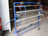 an image of a rack with a bunch of pipes