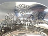 a silver plate with a crown on top of it