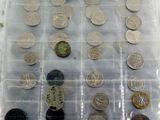 a lot of coins that are in a plastic container