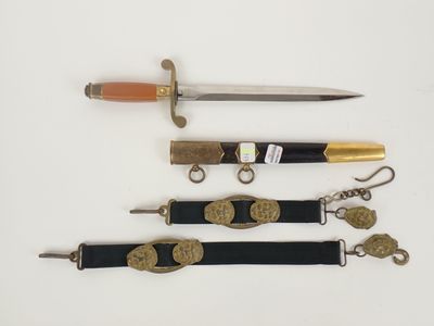 four different types of knives and a keychain on a white surface