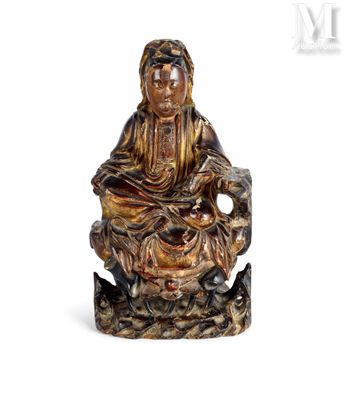an image of a statue of a woman sitting on a tree stump