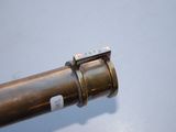 a close up of a pipe on a table with a blue background