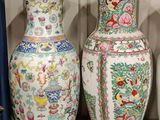 three vases that are sitting next to each other on a shelf