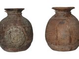 two brown vases sitting side by side on a white background