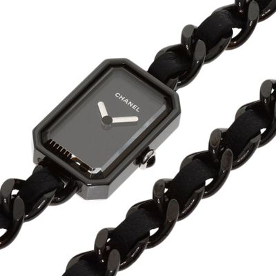 nixon women ' s black stainless steel watch with a black leather strap