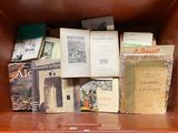 many books on the shelf in the brown case