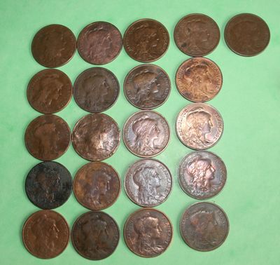a lot of coins that are on a green surface