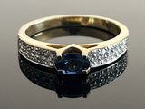 an image of a blue sapphire and diamond ring