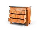 a wooden chest of drawers with three drawers on it