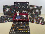 several different types of buttons in a case on a table