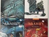 four books of comics are lined up on a white surface