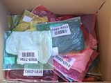 a cardboard box filled with assorted colored items