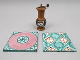three coasters that are sitting on a table