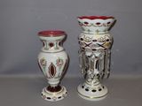 two vases sitting next to each other on a table