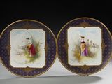 deux assiettes avec une peinture représentant un homme et une femme