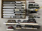 a box with a bunch of different model trains in it