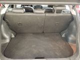 a trunk of a car with the back seats folded down