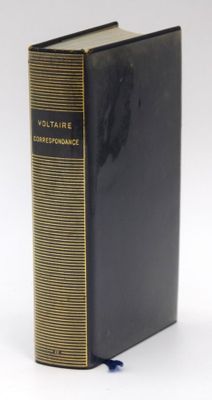 a close up of a book on a white surface