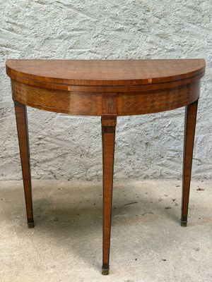 an image of a small wooden table with a curved top