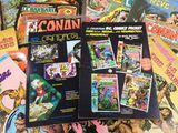 a lot of comic books that are on the table