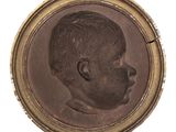 portrait of a young boy in a gold frame on a white background