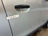 a close up of a car door with a sticker on it