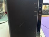 a small black device sitting on top of a desk