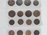 a lot of coins in a plastic case on a table