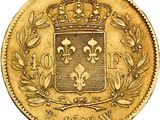 a gold coin with a crown on top of it