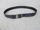 a close up of a black belt with a silver buckle