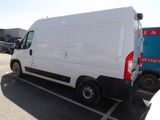 a white van that is parked in a parking lot
