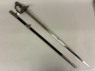 two swords with a black handle on a white surface