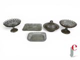 a group of glass dishes and trays sitting on a table