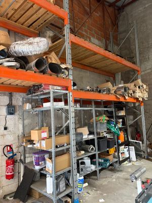 a room filled with lots of shelves and a lot of tools