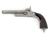 a close up of a gun on a white surface with a white background