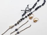a group of jewelry including a necklace, earrings and a bracelet